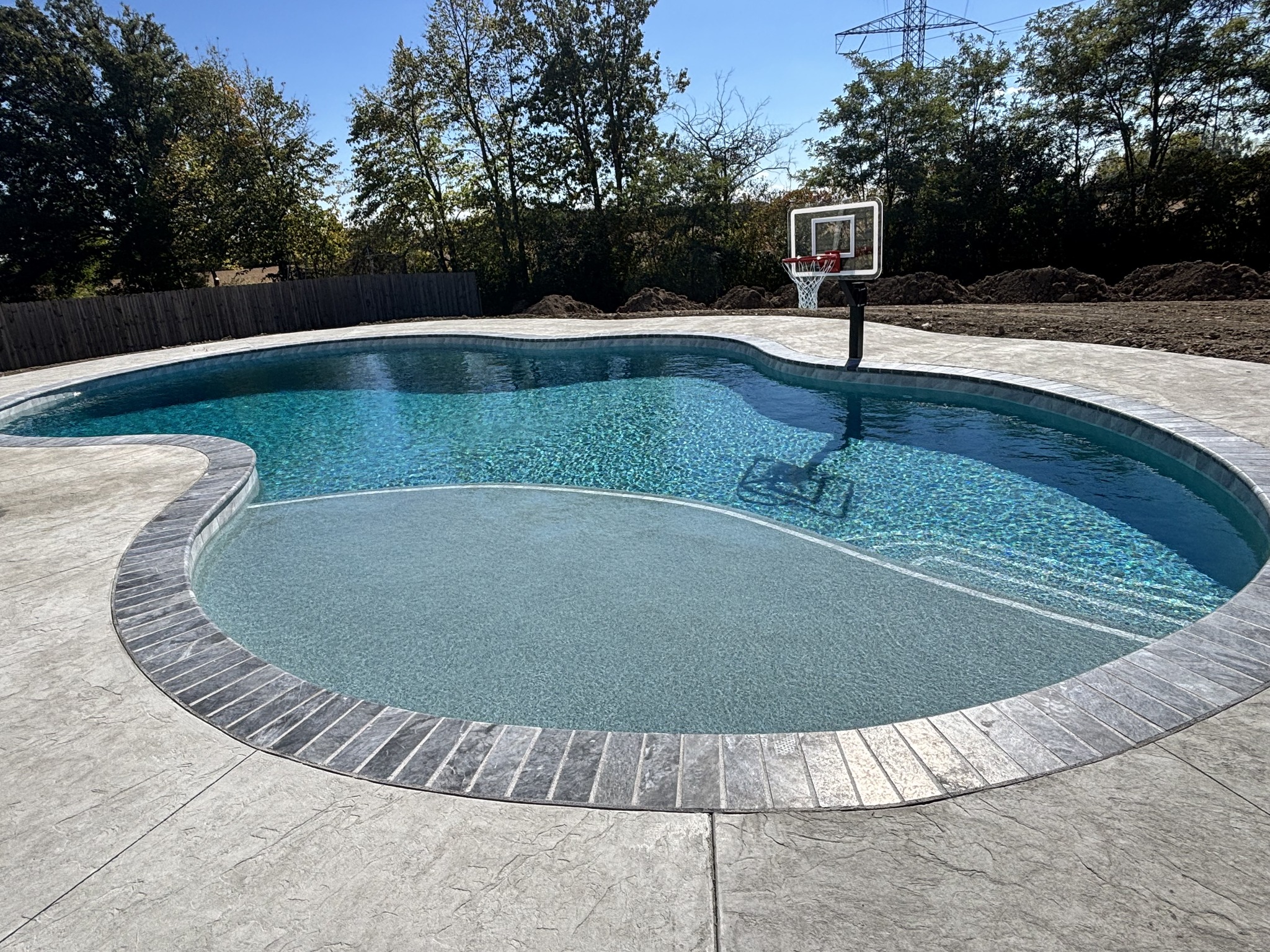 Rock-Solid Artistry: The 100-Ton Foundation of a Perfect Pool Deck - Image 9