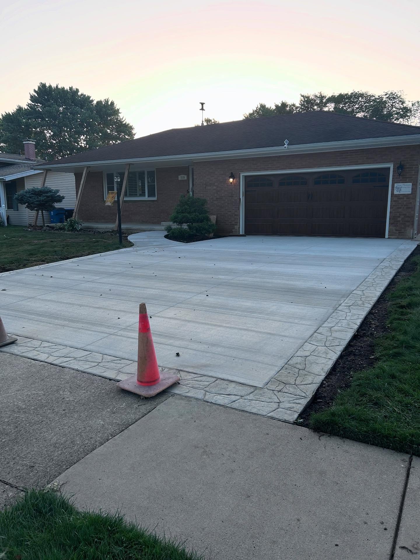 Elevating Curb Appeal with Custom Mixed-Finish Concrete - Image 1