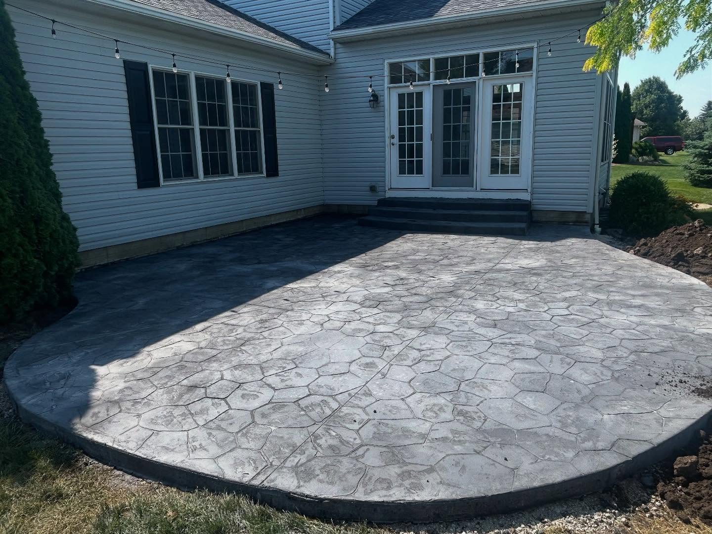 Modern Statement: Bold Black Stamped Concrete Patio - Image 2