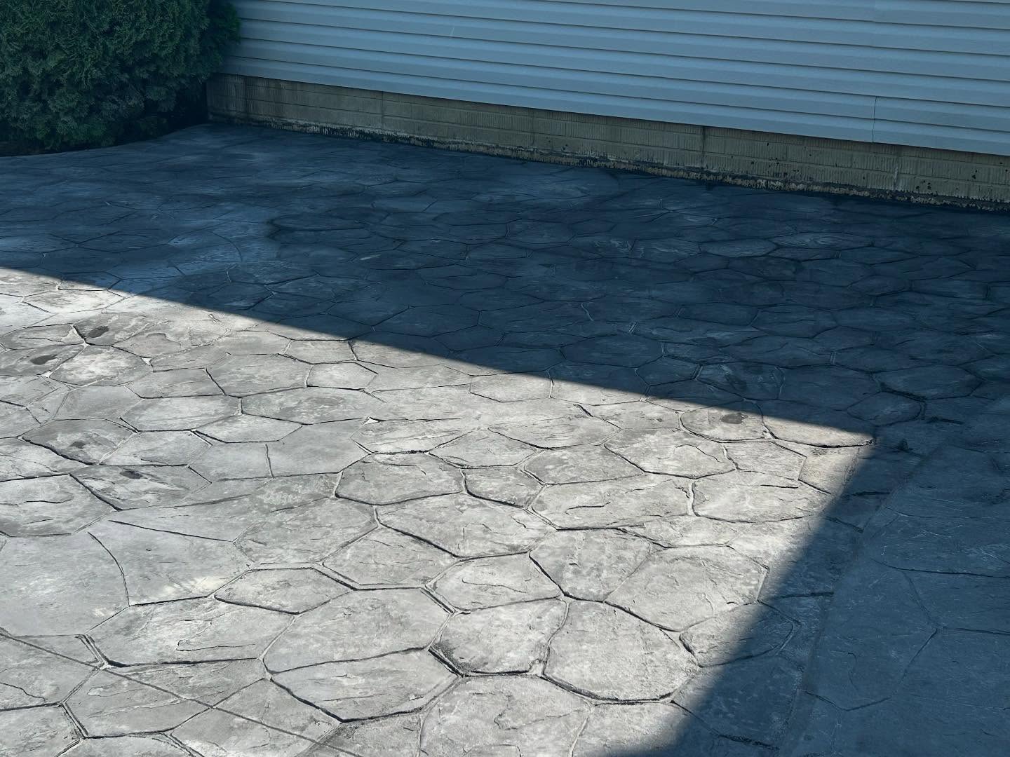 Modern Statement: Bold Black Stamped Concrete Patio - Image 3