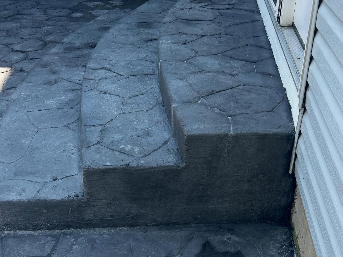 Modern Statement: Bold Black Stamped Concrete Patio - Image 4
